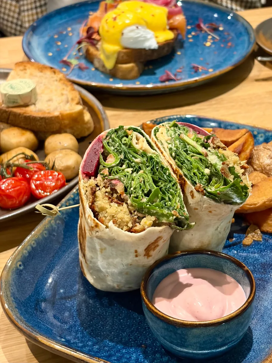 Wrap served with salad and dipping sauce