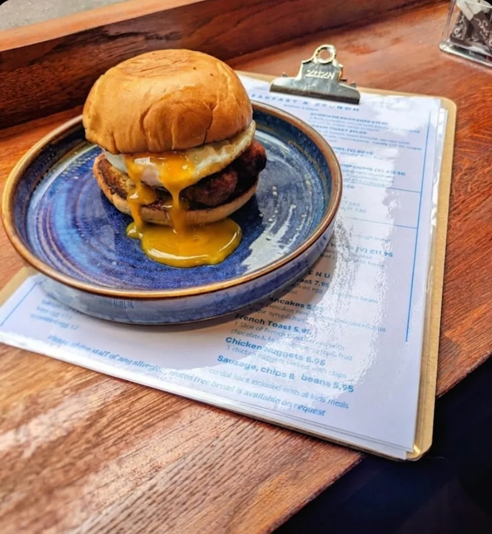 Burger and chips on a blue plate